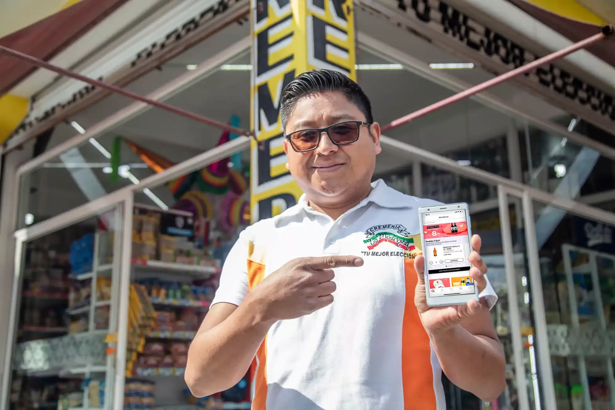 A man showing a delivery app of drinks